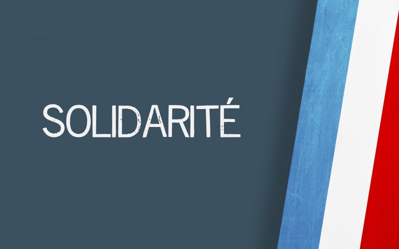 close-up, indoors, wall - building feature, solidarite, typo, built structure, France, information, capital letter, black color, white color, vintage, board