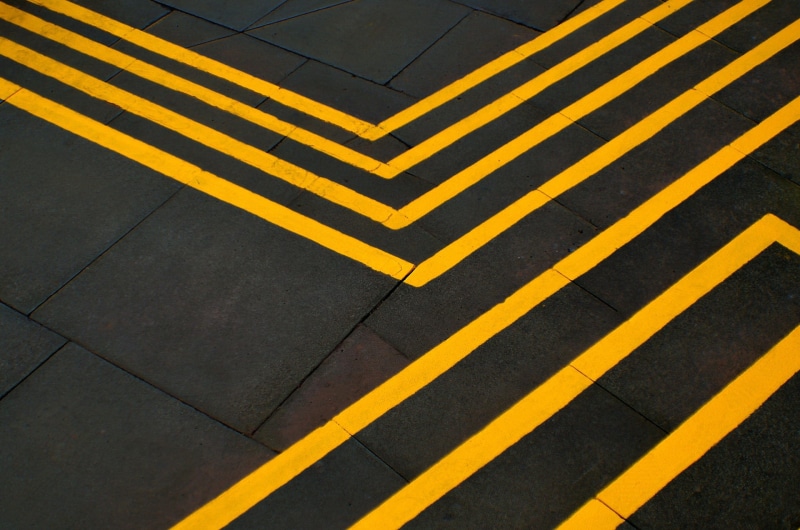 architecture, symbol, background, yellow, backdrop, no people, transportation, square, room, flooring, material, single line, road, road marking, concrete