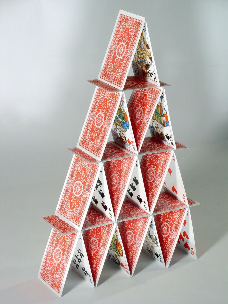 table, close-up, house, art and craft, no people, puzzle, play, celebration, high angle view, focus on foreground, stack, group of objects, shape, food and drink