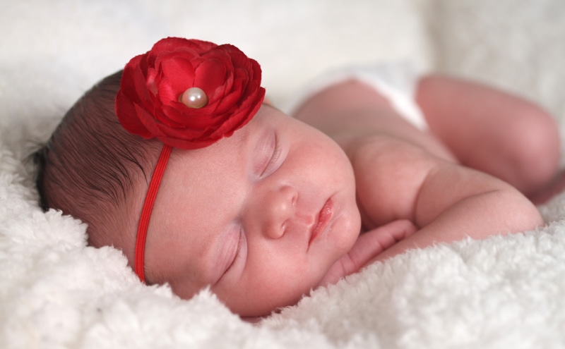 red, child, one person, headband, sleeping, blanket, fragility, close-up, indoors, childhood, lying down, innocence, young, Artistic, flower, Beautiful