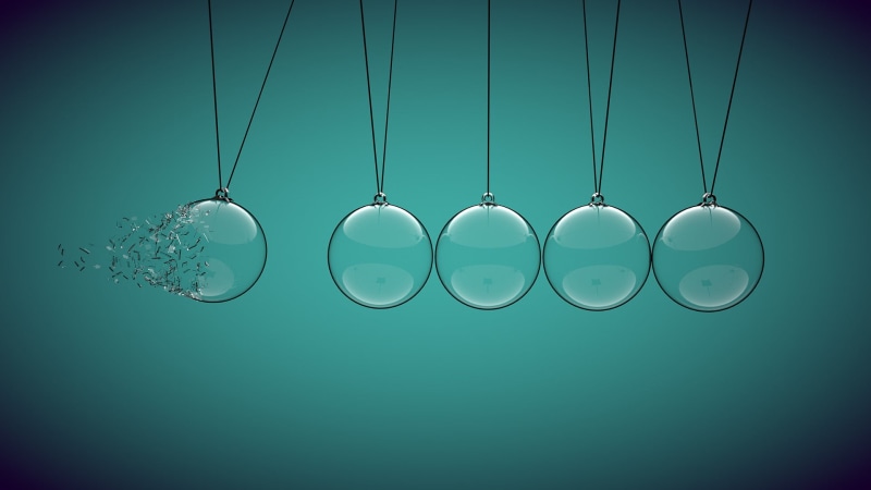ball, glass, shiny, no people, hanging, physics, clear, simple, group of objects, five, in a row, colored background, turquoise colored, metal, side by side