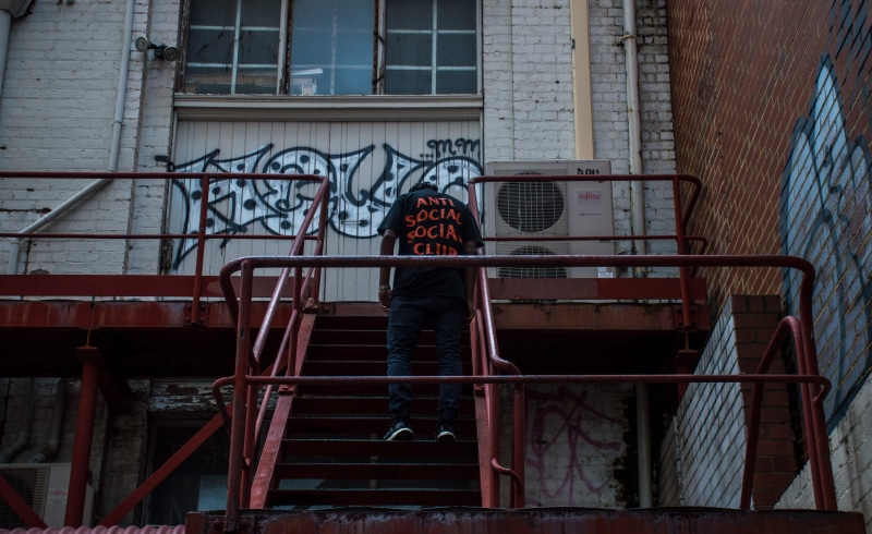 day, anti social social club, 5K, assc, window, standing, building, fashion, graffiti, abandoned, casual clothing, streetwear, one person, railing, hype