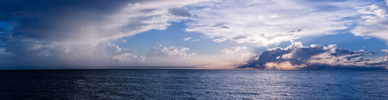cloud - sky, ocean, outdoors, water, seascape, blue, beach, nature, sky, sea, horizon, rain, dark, beauty in nature, tranquility, storm, tropical climate