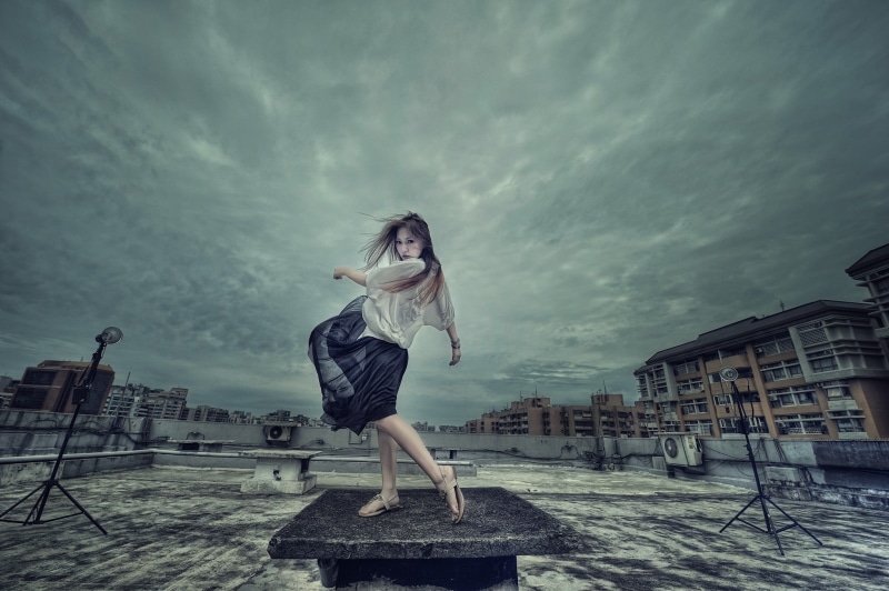 outdoors, Asian, nature, rooftops, building exterior, one person, young adult, blue skirt, hairstyle, sky, day, cloud - sky, brunette, adult, leisure activity
