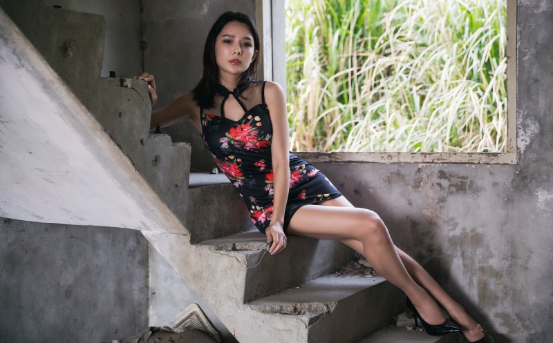real people, Cheongsam, stiletto, stairs, women, full length, lifestyles, brunette, black heels, hairstyle, young women, contemplation, sitting, high heels