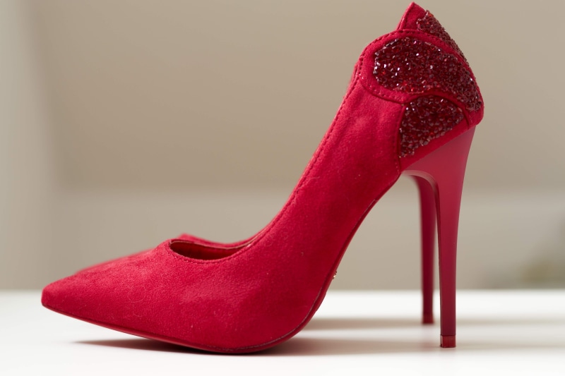 studio shot, fashionable, leather, shiny, surface, indoors, elegance, pointed, high heels, stiletto, toe, shining, shoe, luxury, blurred background, footwear