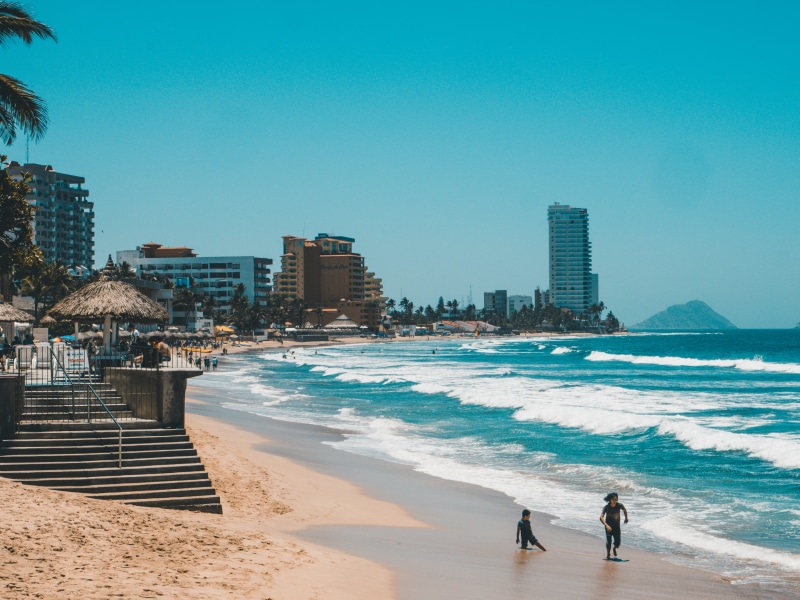 4K, land, two people, fun, city, outdoors, lifestyles, built structure, beaach, ocean, nature, beach, sea, sky, real people, clear sky, building exterior