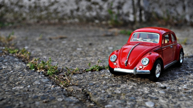 toy car, scale, city, Volkswagen, 1080P, Volkswagen Beetle, toys, street, nature, car, motor vehicle, rock - object, focus on foreground, macro, land vehicle