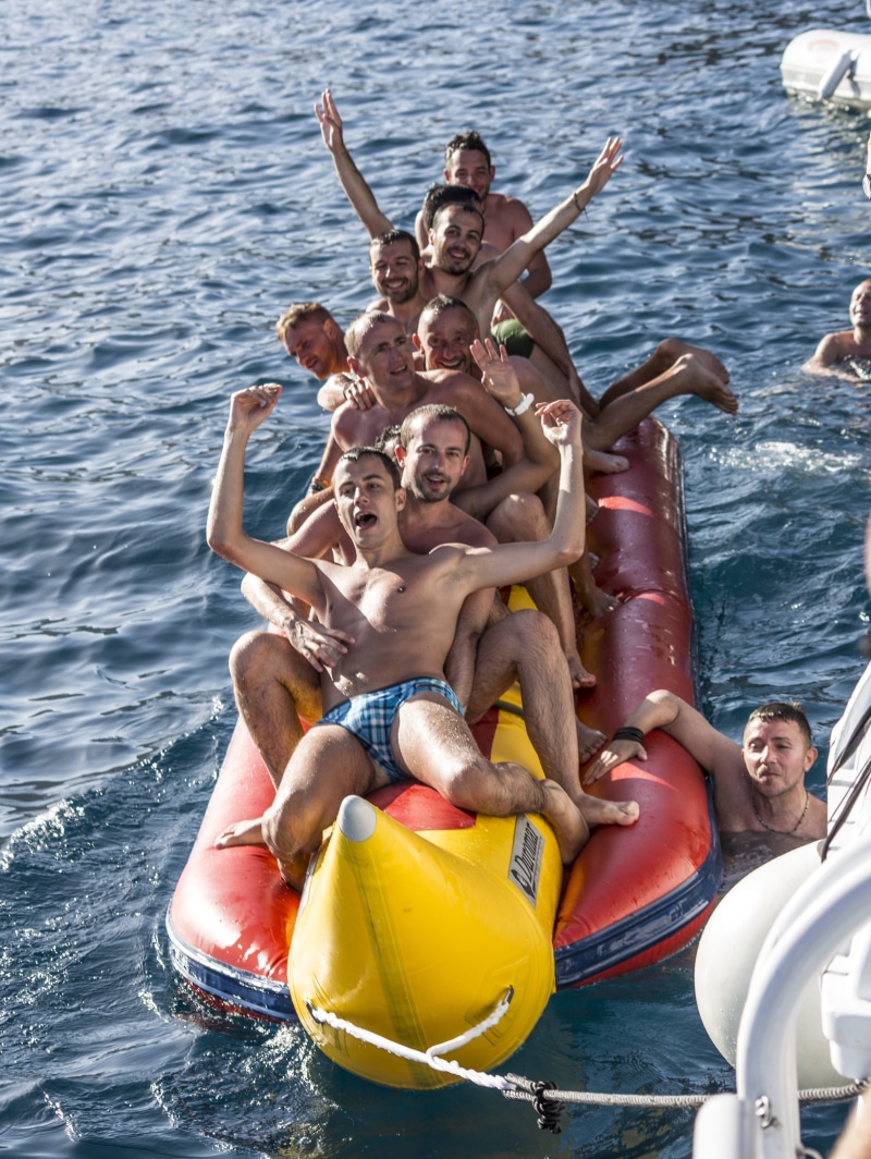 holiday, banana, outdoors, men, group, inflatable, young men, males, drunk, boys, frolic, enjoyment, grin, group of people, 4K, sea, portrait, boat, floating on water