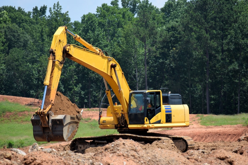road construction, landscape, sky, backhoe, architecture, road, tree, construction site, industrial equipment, building, property, outdoors, project, earth mover