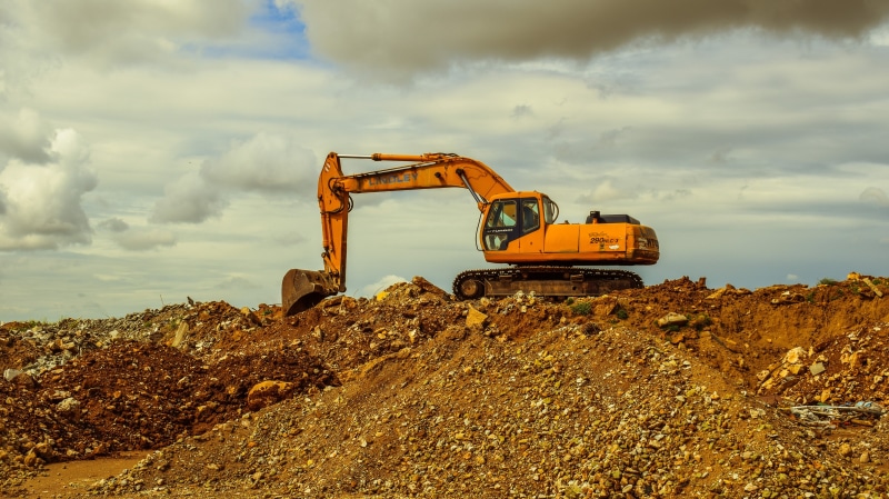 transportation, vehicle Scoop, dirt, cloudy, building - Activity, digging, cloud - sky, heavy machine, development, construction Industry, machinery, orange