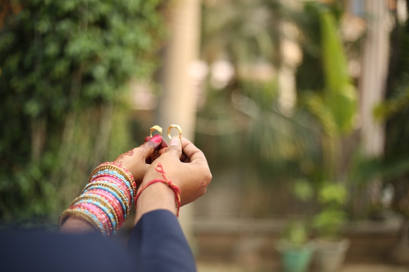 jewelry, gold, focus on foreground, nature, real people, nail polish, leisure activity, low section, one person, 5K, women, plant, lifestyles, body part