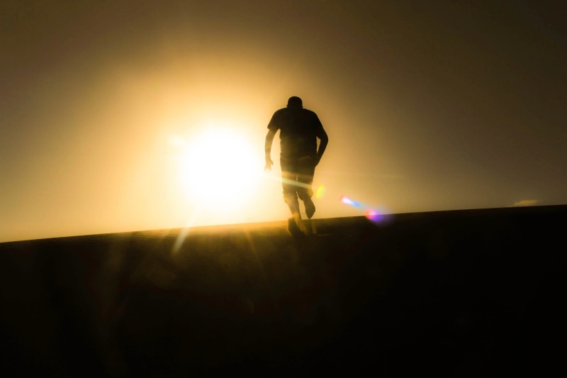 lifestyles, nature, full length, 2K, sun, silhouette, running, sky, people, black, back, only men, sunlight, sunset, man, standing, one person, men, sunbeam