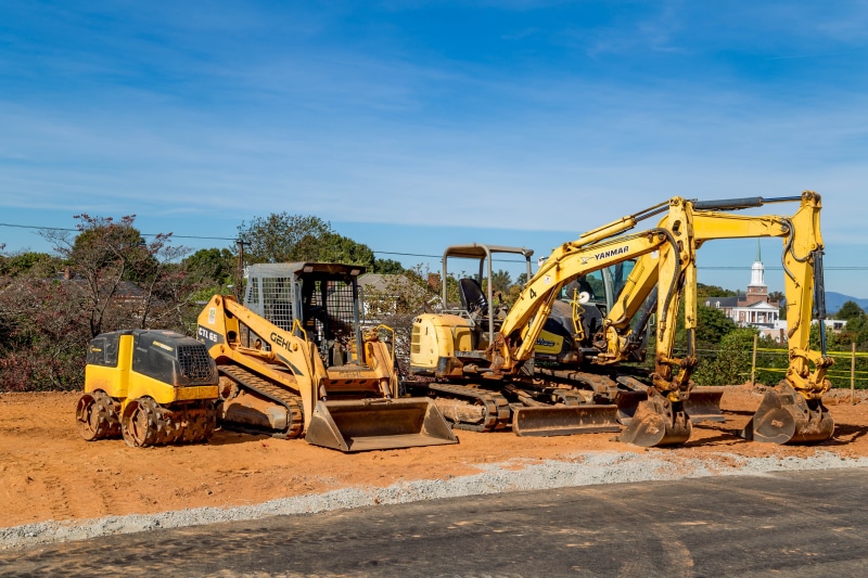 heavy equipment, day, work, bulldozer, construction vehicle, vehicle, no people, land vehicle, outdoors, equipment, machinery, yellow, excavate, trees