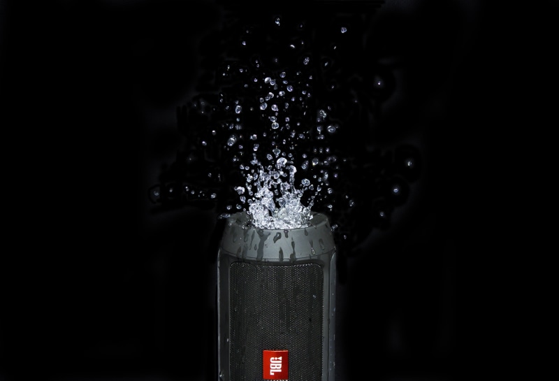 portable, stereo, freshness, drink, single object, splash, speakers, no people, studio shot, music, jbl, refreshment, motion, indoors, water, food, black color