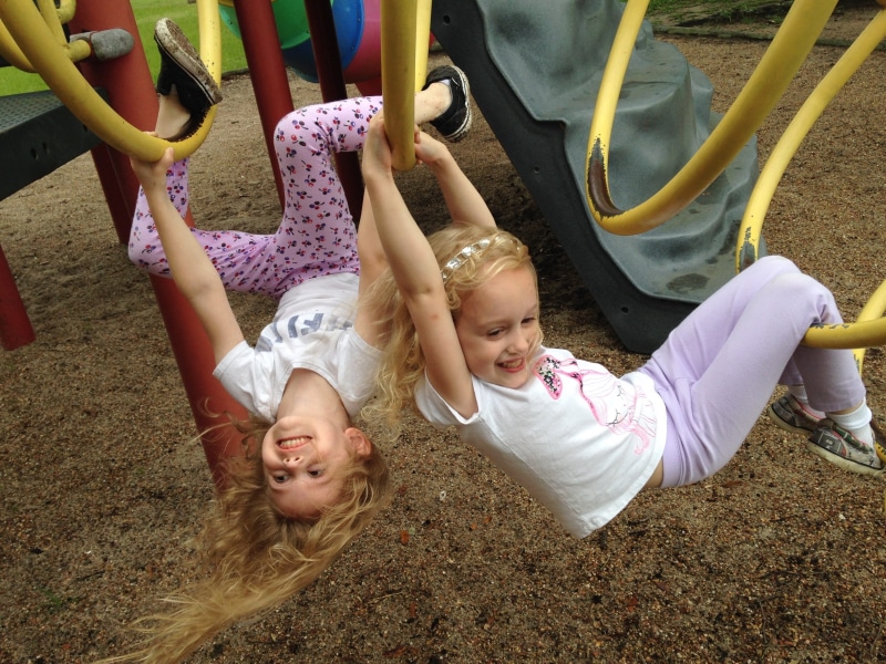 hanging, child, monkey bars, cute, real people, casual clothing, sister, holding, happy, people, bars, summer, park - Man Made Space, children Only, caucasian Ethnicity