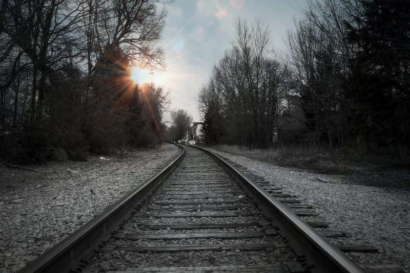 outdoors, parallel, sunset, diminishing perspective, direction, vanishing point, no people, transportation, tree, rail transportation, railroad track, black