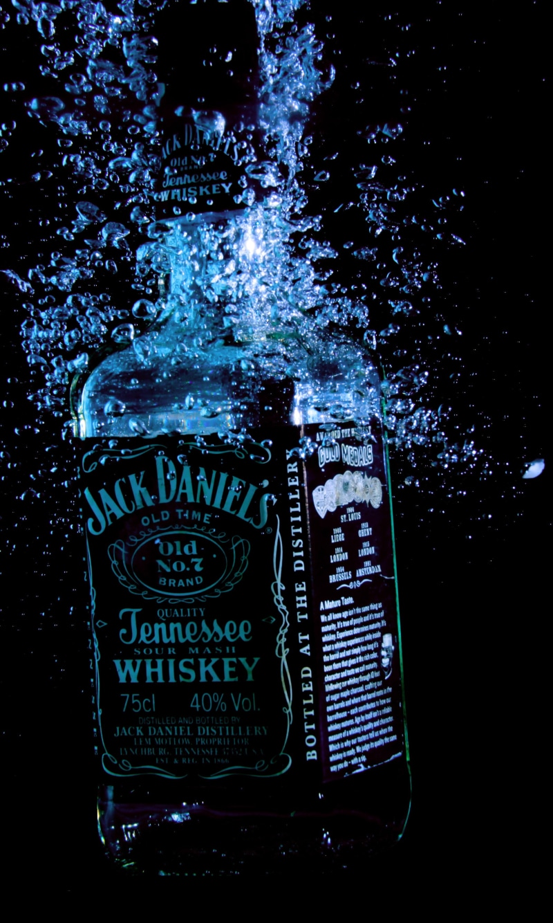 2K, whiskey, alcohol, jack daniels, splashing, western script, motion, water, refreshment, nature, day, indoors, food and drink, architecture, liquid