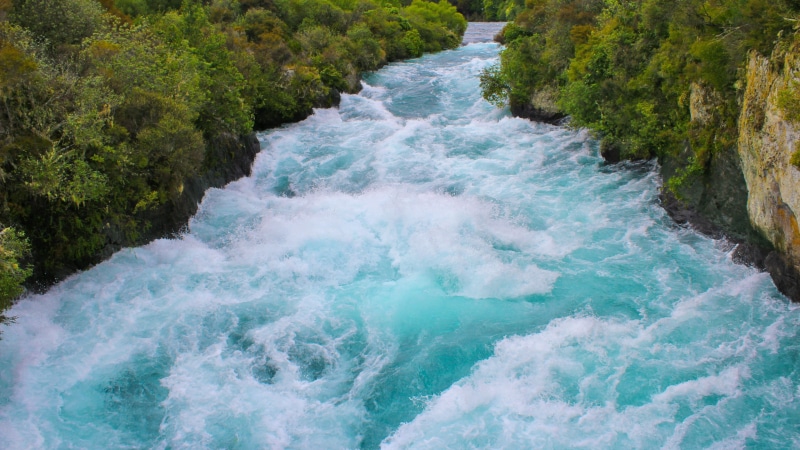 motion, power in nature, flowing water, flowing, aquatic sport, green color, sea, day, outdoors, plant, Huka Falls, turquoise colored, body, waterfront