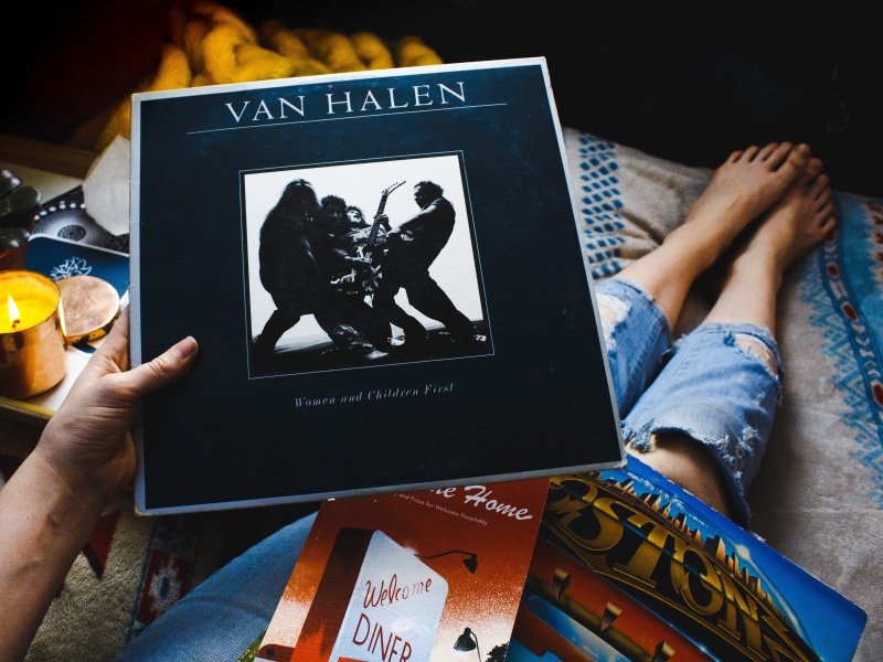 real people, rock, van, black, finger, album, personal perspective, person, holding, human limb, cover, dark, close-up, hand, human foot, indoors, music