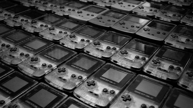 Nintendo, video games, large group of objects, in a row, pattern, retro games, abundance, choice, indoors, high angle view, equipment, coil, no people