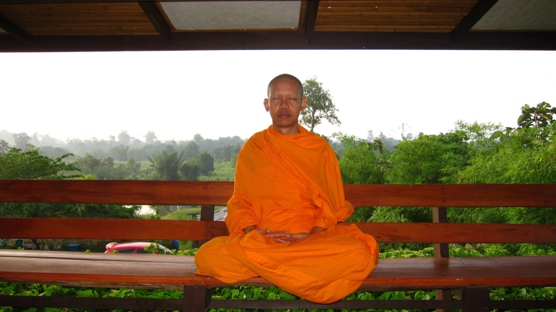 standing, day, real people, sitting, men, one person, outdoors, tree, portrait, traditional clothing, 072, orange color, buddhist, casual clothing, plant