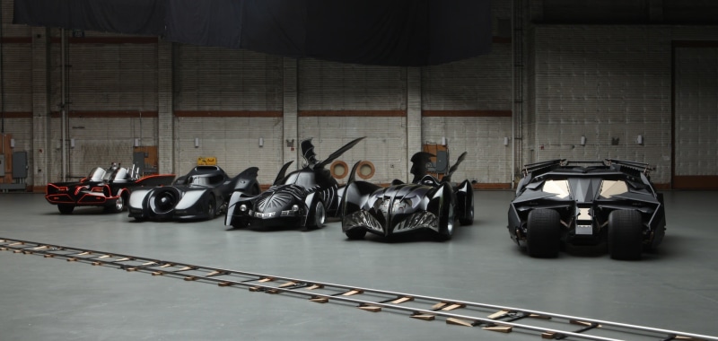 car, Batmobile, vehicle, still life, motor vehicle, batmobiles, transportation, human representation, art and craft, architecture, representation, figurine
