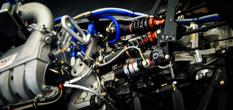 engine, machinery, no people, racing car, chrome, competition, land vehicle, auto, racing car engine, car engine, transportation, mechanical, indoors, black