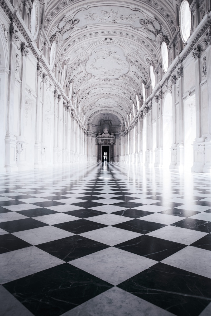 illuminated, chess, in a row, checked pattern, indoors, king, flooring, ceiling, lavish, grayscale, marble, lighting equipment, arcade, photography, arch