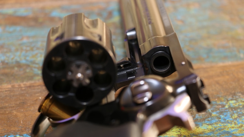 still life, revolver, target shooting, close-up, focus on foreground, sports equipment, toy, metal, weapon, Ruger GP100, Ruger, adventure, selective focus
