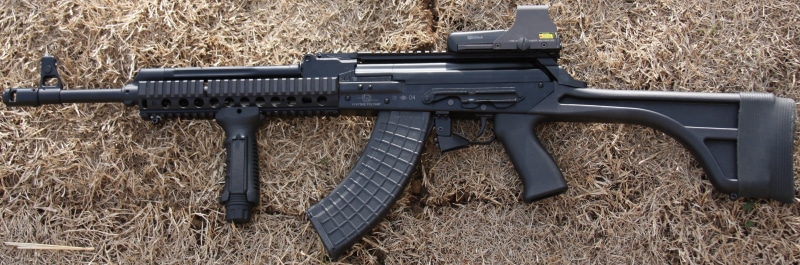 rifle, VEPR, hay, ammunition, no people, land, target shooting, plant, day, aggression, military, nature, single object, weapon, outdoors, communication