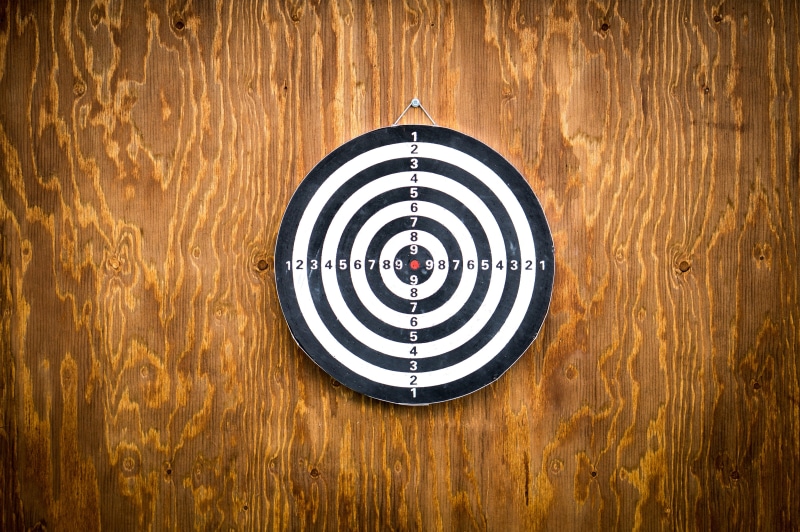 arrow, brown, day, wooden, white, recreation, throw, black, no people, shape, accuracy, wall - building feature, dart board, wood, sports target, accuracye