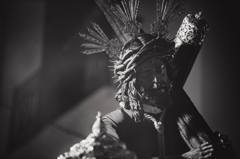 headdress, mask, lifestyles, mask - disguise, sculpture, day, nature, one person, obscured face, carnival - celebration event, headwear, grayscale, feather