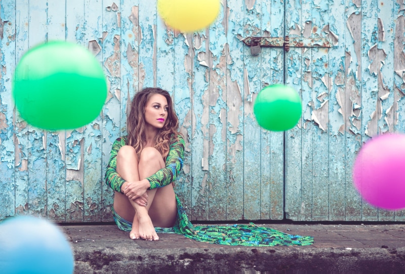 sitting, dress, women outdoors, long hair, full length, front view, adult, young women, balloon, one person, real people, hair, urban decay, barefoot, hairstyle
