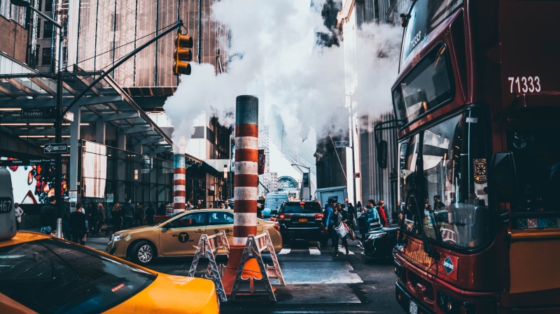 buses, yellow, car, street, group of people, building exterior, city life, taxi, mode of transportation, motor vehicle, built structure, office building exterior