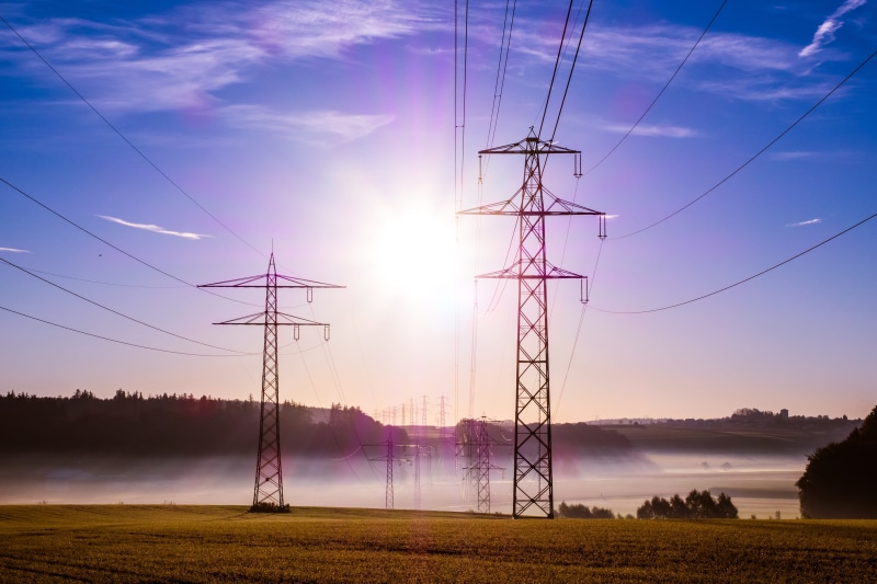 industrial, pylons, meadow, wire, lens flare, steel, sunrise, fuel and power generation, cloud - sky, woods, sky, outdoors, utility poles, grass, power poles