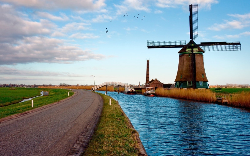 cloud - Sky, non-Urban Scene, blue, black, renewable energy, no people, meadow, road, alternative energy, outdoors, rural Scene, the way forward, netherlands