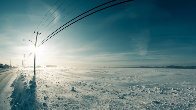 tranquil scene, landscape, no people, transportation, black, beach, environment, water, tower, beauty in nature, cold temperature, sea, power lines, electricity