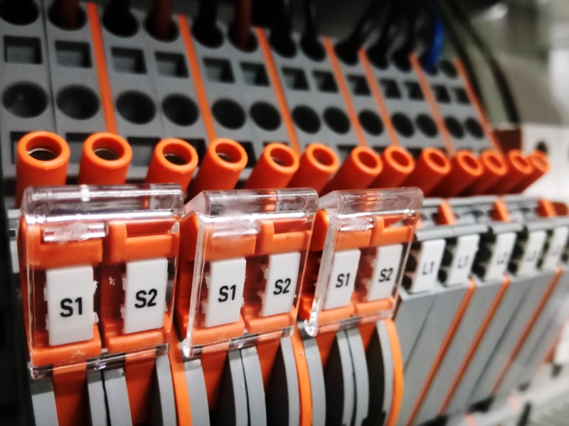 control cabinet, indoors, large group of objects, no people, white, communication, power line, technology, Current, switch, Cable, orange color, profession