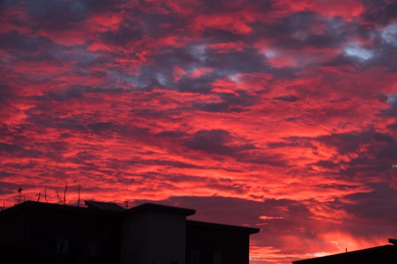 romantic sky, no people, ominous, building exterior, dramatic sky, built structure, building, dusk, low angle view, 5K, orange color, architecture, sky
