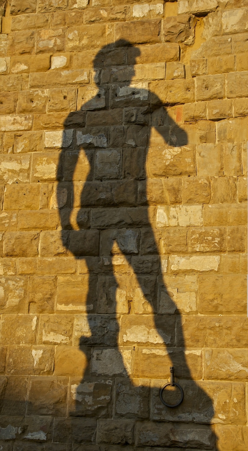 focus on shadow, outdoors, outside, representation, sunlight, day, stone, built structure, michelangelo, shadow, men, statue, wall - building feature, wall