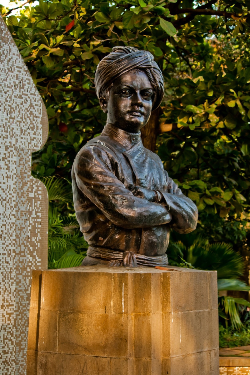 memorial, angel, representation, bronze, bust, statue, india, male likeness, park - man made space, swami vivekananda, day, plant, sculpture, tree, religion