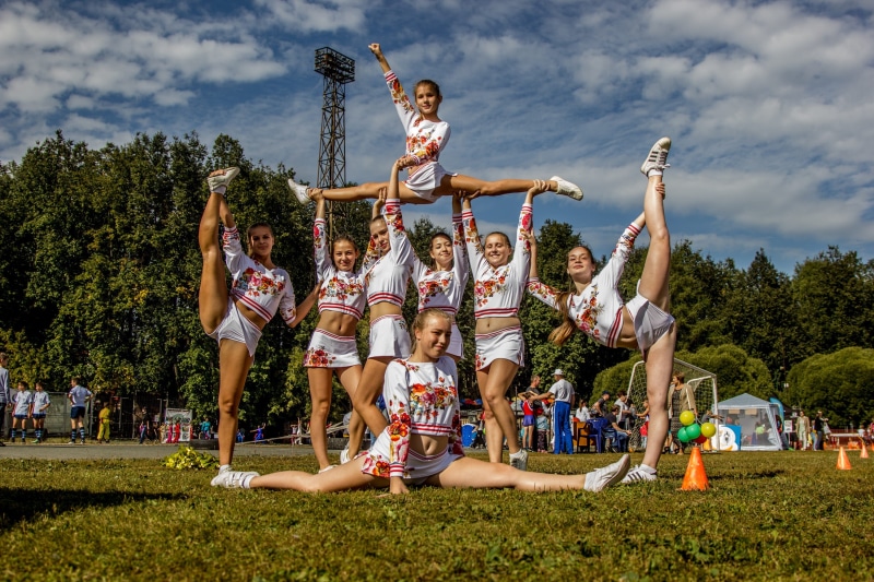 cloud - sky, Cheerleading, human arm, nature, cheerleaders, outdoors, stadium, Girls, ground, sport, limb, child, fun, 2K, competition, playful, full length