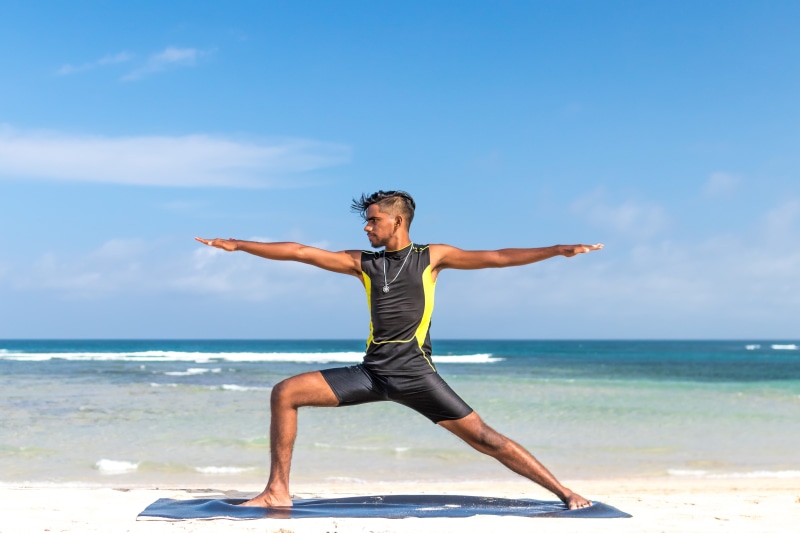 recreation, wet, leisure, stretching, health, relax, peaceful, vacation, water, suit, healthy, breathe, fun, arms raised, land, outfit, concentration, young