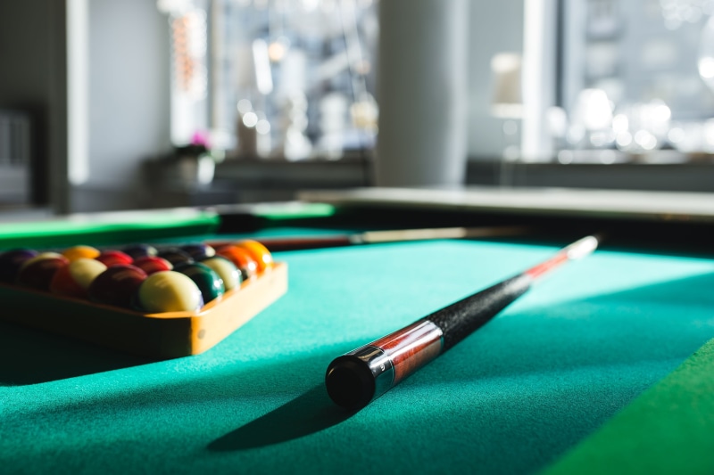 focus on foreground, time, leisure Games, playing, pool, hobby, ball, relaxation, hobbies, green, no people, billiard cue, pool ball, still life, pool - cue sport