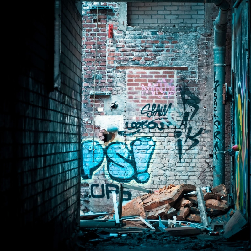 western script, art and craft, street, day, art, built structure, outdoors, city life, building exterior, brick, broken, 2K, abandoned, graffiti, wall