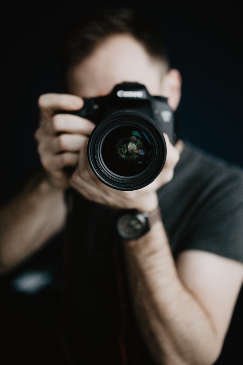 hand, photoshoot, camera, photographing, men, holding, passion, working, photographic equipment, dslr, activity, black background, photos, hobby, one person