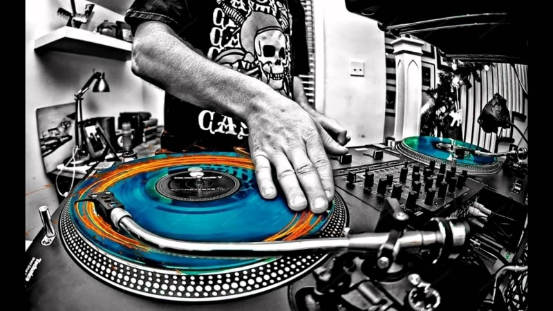 one person, arts culture and entertainment, DJ, selective coloring, mixing, nightlife, real people, night, blue, human body part, gray, turntables, orange