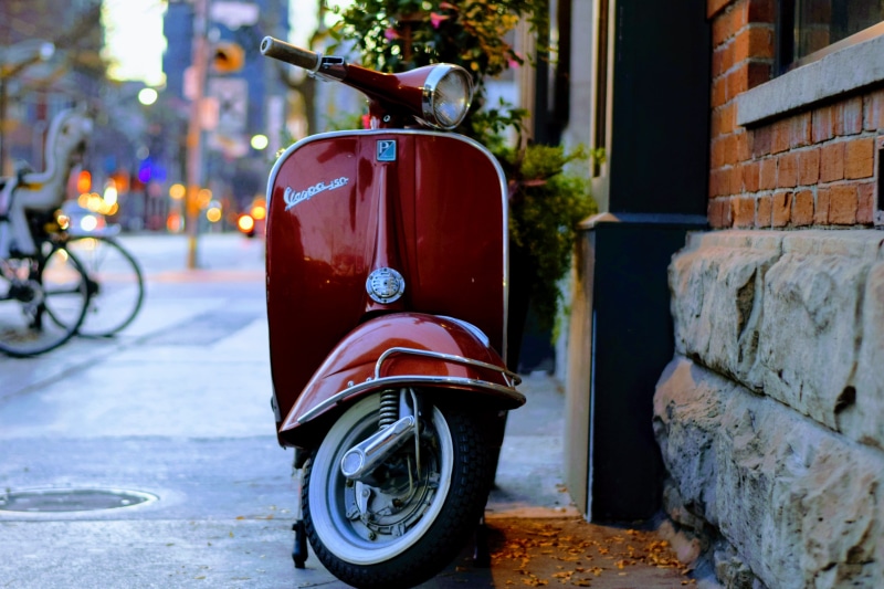 bicycle, architecture, wheel, built structure, road, mode of transportation, town, travel, land vehicle, red, vintage, motor vehicle, building exterior