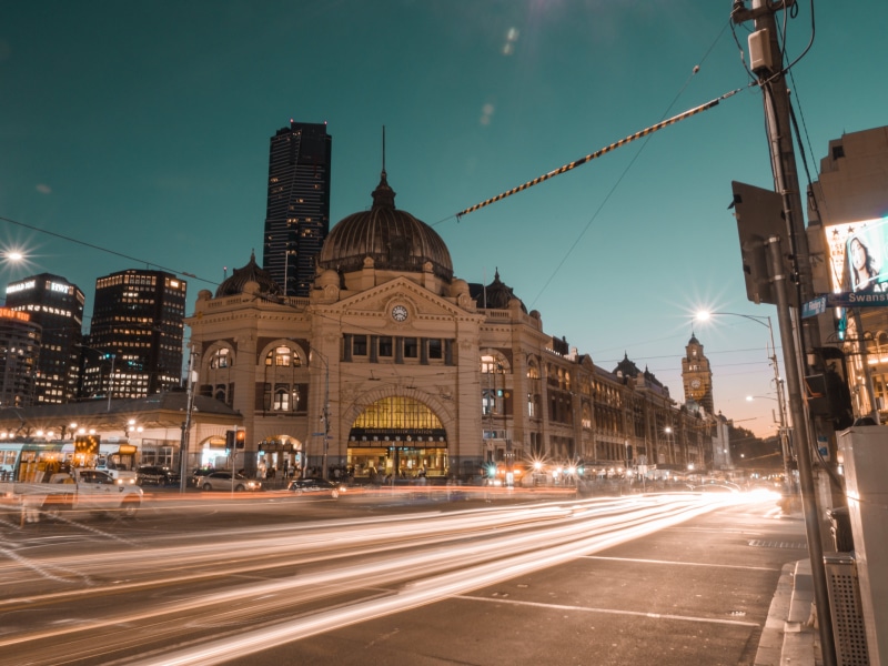 flinders street, travel destinations, motion, city, outdoors, flinders street station, technology, transportation, urban, cbd, history, illuminated, business